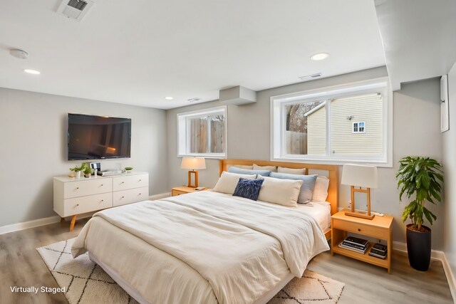 337 W 106th Pl, Chicago, IL 60628 - bedroom featuring light wood-style flooring, baseboards, and recessed lighting