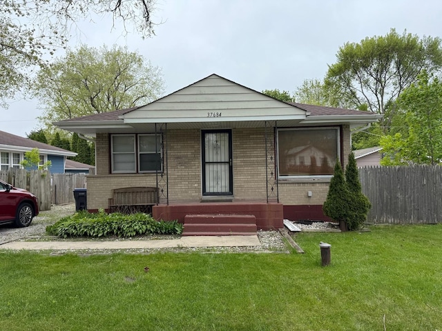 37684 N Sheridan Rd, Beach Park, IL 60087 - bungalow-style home featuring brick siding, a porch, and a shingled roof