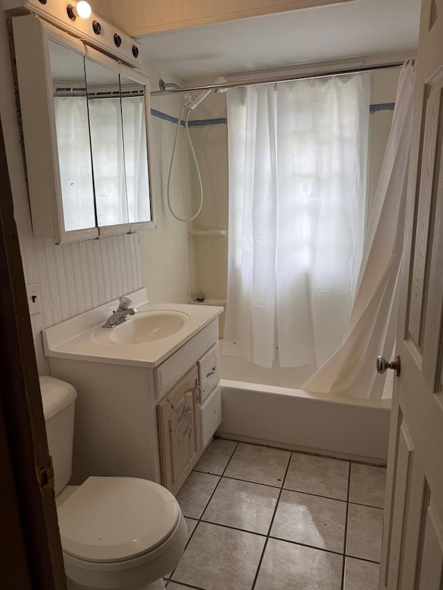 37684 N Sheridan Rd, Beach Park, IL 60087 - full bathroom with tile patterned floors, shower / bathtub combination with curtain, toilet, and vanity