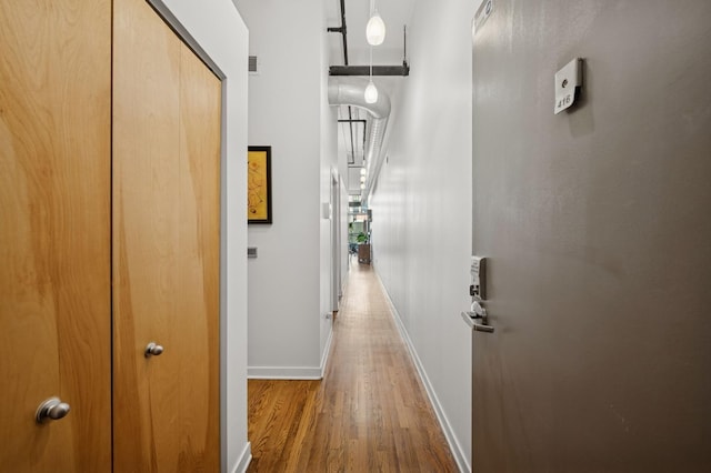1224 W Van Buren Ave Unit 416, Chicago, IL 60607 - hallway featuring wood finished floors and baseboards