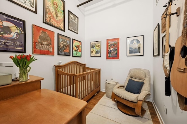 1224 W Van Buren Ave Unit 416, Chicago, IL 60607 - bedroom with wood finished floors, a nursery area, and baseboards