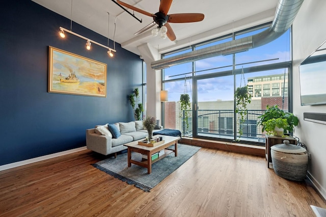 1224 W Van Buren Ave Unit 416, Chicago, IL 60607 - living area with wood finished floors, ceiling fan, and baseboards