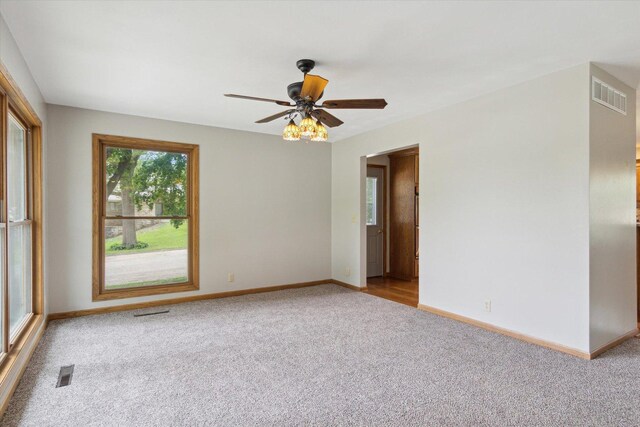 717 S Kennedy St, Shannon, IL 61078 - carpeted empty room featuring baseboards and a ceiling fan