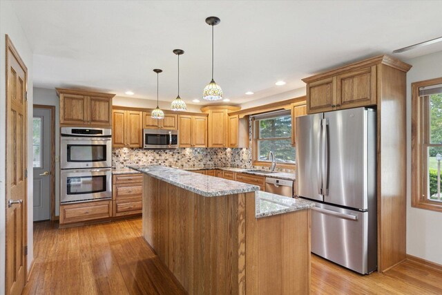 717 S Kennedy St, Shannon, IL 61078 - kitchen featuring appliances with stainless steel finishes, a sink, light wood-style floors, healthy amount of natural light, and recessed lighting