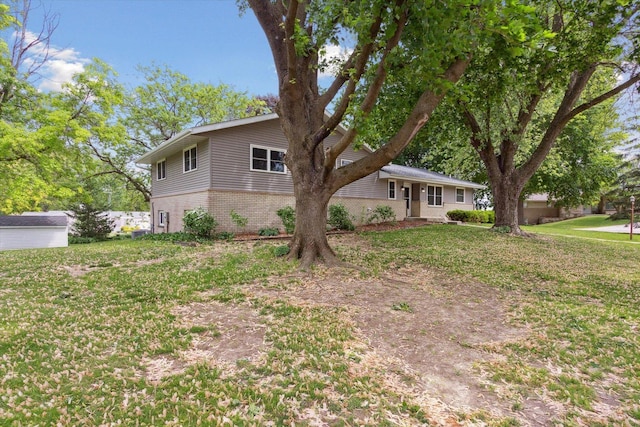 717 S Kennedy St, Shannon, IL 61078 - view of front of house featuring brick siding and a front lawn