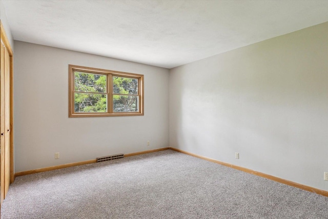 717 S Kennedy St, Shannon, IL 61078 - unfurnished room featuring light colored carpet and baseboards