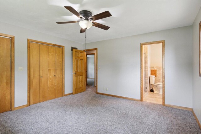 717 S Kennedy St, Shannon, IL 61078 - unfurnished bedroom with carpet flooring, baseboards, ensuite bathroom, and multiple closets