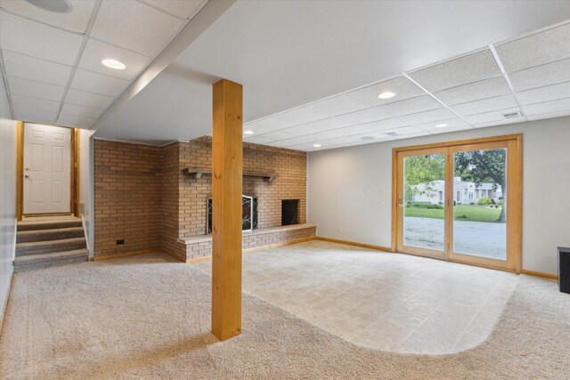 717 S Kennedy St, Shannon, IL 61078 - unfurnished living room featuring a fireplace, carpet, baseboards, recessed lighting, and a drop ceiling