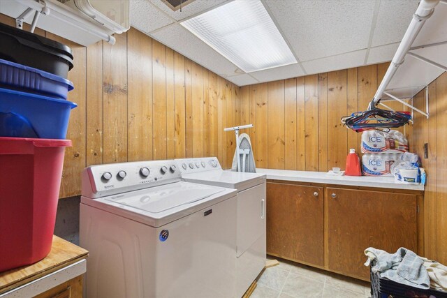 717 S Kennedy St, Shannon, IL 61078 - laundry room with washer and dryer, wooden walls, and cabinet space