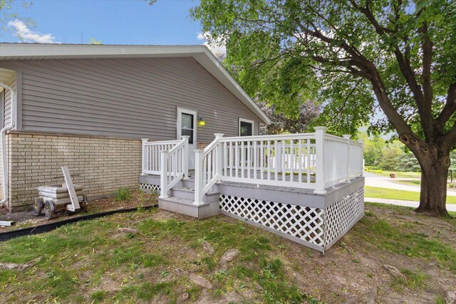 717 S Kennedy St, Shannon, IL 61078 - back of house with a wooden deck and brick siding
