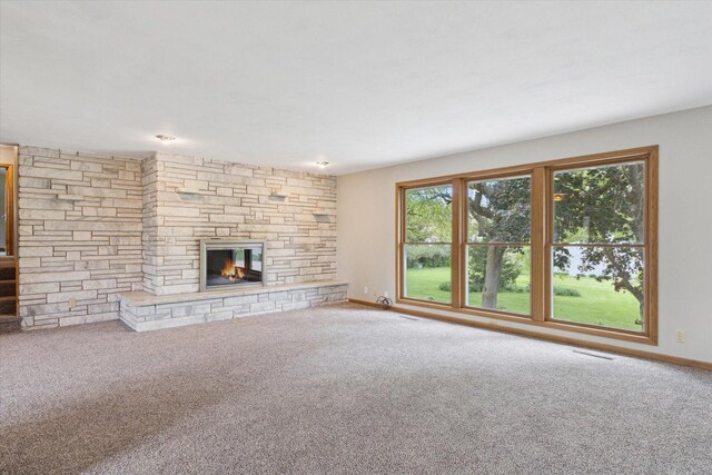 717 S Kennedy St, Shannon, IL 61078 - unfurnished living room with a fireplace, carpet, and baseboards