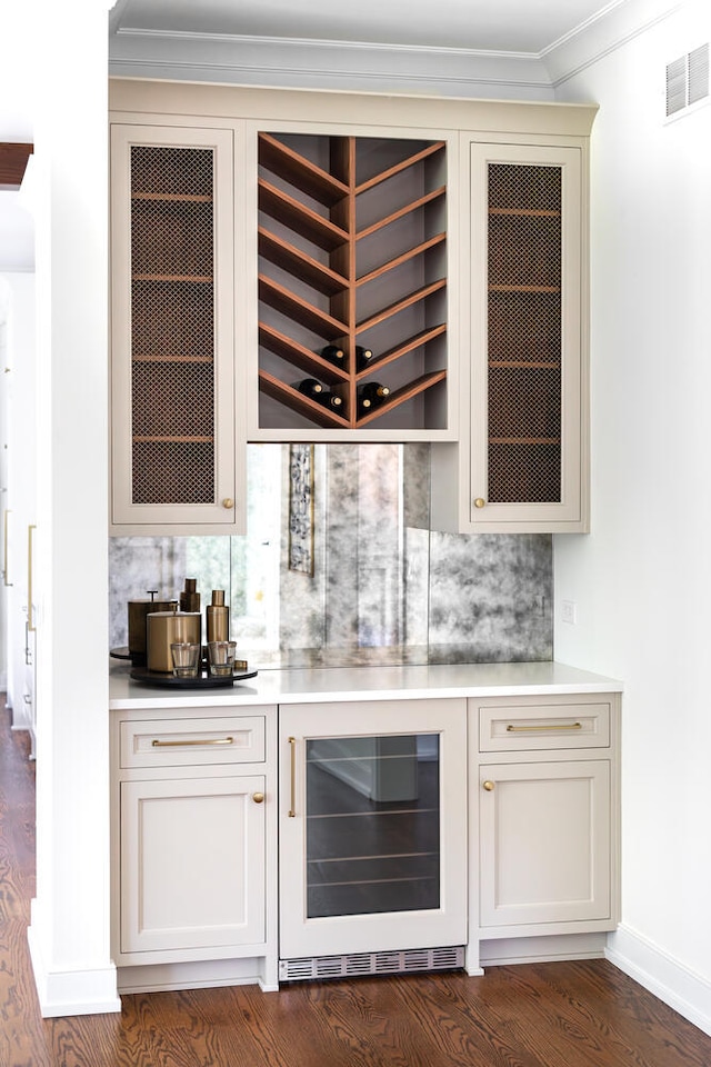 706 S Loomis St, Naperville, IL 60540 - indoor dry bar with wine cooler, ornamental molding, backsplash, and dark wood-style floors