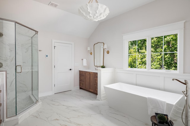 706 S Loomis St, Naperville, IL 60540 - bathroom with marble look tile flooring, vanity, a marble finish shower, a freestanding tub, and a chandelier