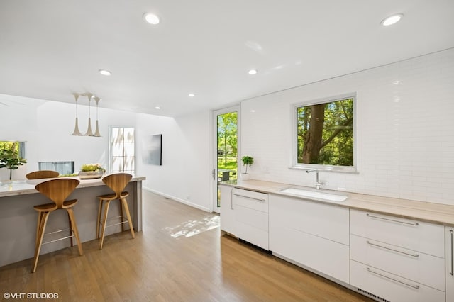 938 Old Green Bay Rd, Winnetka, IL 60093 - kitchen featuring a sink, modern cabinets, recessed lighting, white cabinetry, and light wood finished floors