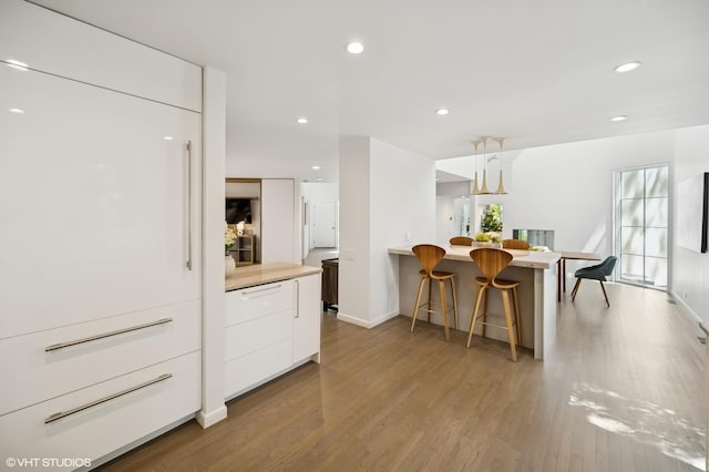 938 Old Green Bay Rd, Winnetka, IL 60093 - dining room with light wood-style floors, recessed lighting, and baseboards