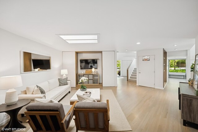938 Old Green Bay Rd, Winnetka, IL 60093 - living room with stairs, light wood-style flooring, and recessed lighting