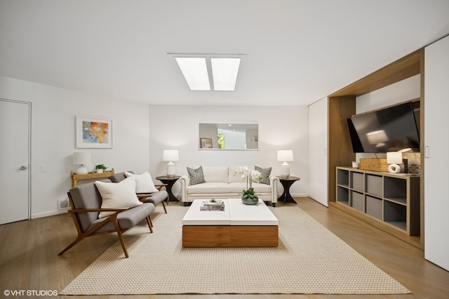 938 Old Green Bay Rd, Winnetka, IL 60093 - living room with light wood finished floors and a skylight