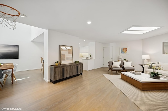 938 Old Green Bay Rd, Winnetka, IL 60093 - living area featuring light wood-style floors, a skylight, baseboards, and recessed lighting