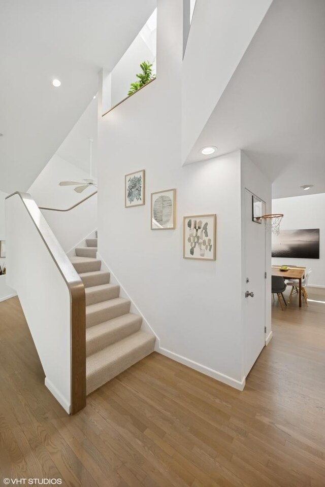938 Old Green Bay Rd, Winnetka, IL 60093 - stairway featuring wood finished floors, baseboards, and recessed lighting