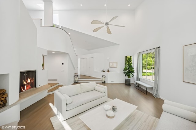 938 Old Green Bay Rd, Winnetka, IL 60093 - living room with wood finished floors, stairway, a high ceiling, a ceiling fan, and recessed lighting