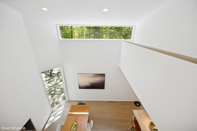 938 Old Green Bay Rd, Winnetka, IL 60093 - stairway featuring healthy amount of natural light, wood finished floors, recessed lighting, and baseboards