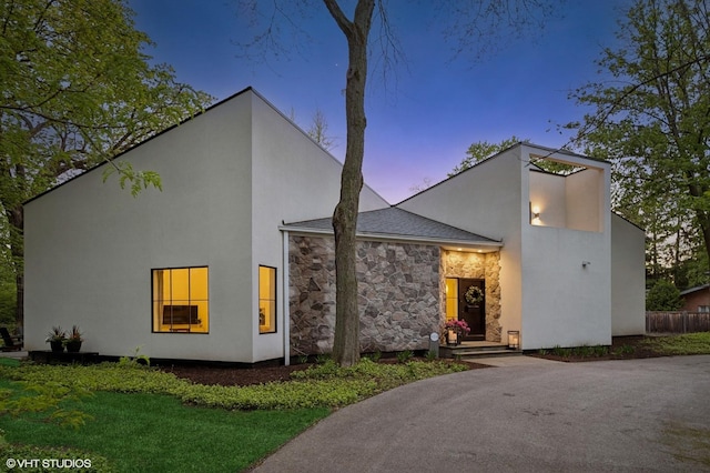 938 Old Green Bay Rd, Winnetka, IL 60093 - modern home with stone siding, stucco siding, and a yard