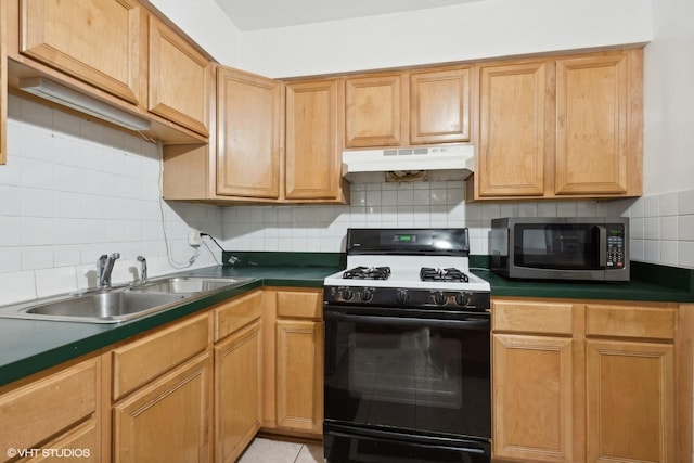 9561 Dee Rd Unit 2G, Des Plaines, IL 60016 - kitchen with gas range oven, stainless steel microwave, under cabinet range hood, a sink, and dark countertops