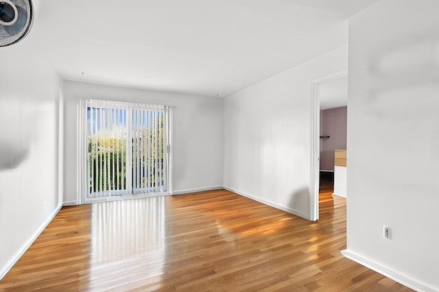 9561 Dee Rd Unit 2G, Des Plaines, IL 60016 - empty room featuring wood finished floors and baseboards