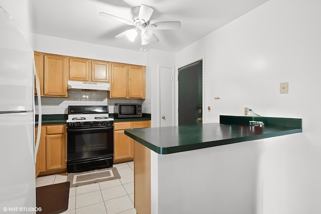 9561 Dee Rd Unit 2G, Des Plaines, IL 60016 - kitchen with gas stove, stainless steel microwave, freestanding refrigerator, under cabinet range hood, and dark countertops
