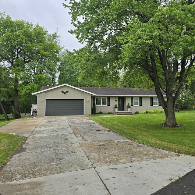 1810 Sylvan Ct, Freeport, IL 61032 - ranch-style house featuring an attached garage, concrete driveway, a front lawn, and brick siding