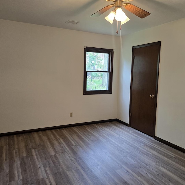 1810 Sylvan Ct, Freeport, IL 61032 - spare room with wood finished floors, baseboards, and a ceiling fan