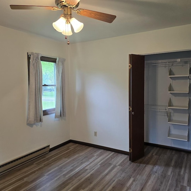 1810 Sylvan Ct, Freeport, IL 61032 - spare room with a baseboard radiator, dark wood-style floors, ceiling fan, and baseboards