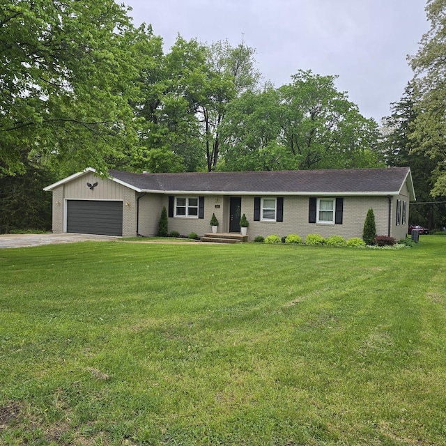 1810 Sylvan Ct, Freeport, IL 61032 - ranch-style house with a garage, a front yard, brick siding, asphalt driveway, and view of scattered trees