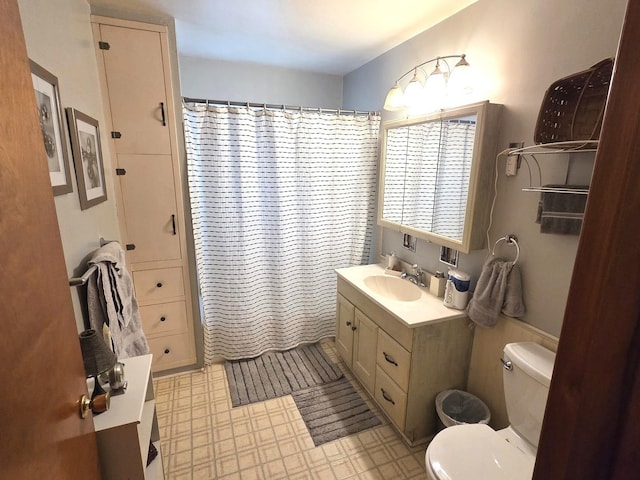 405 W Randolph St, Heyworth, IL 61745 - full bathroom with toilet, vanity, tile patterned floors, and curtained shower