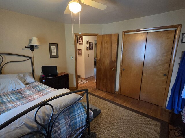 405 W Randolph St, Heyworth, IL 61745 - bedroom featuring wood finished floors, a closet, ceiling fan, and baseboards