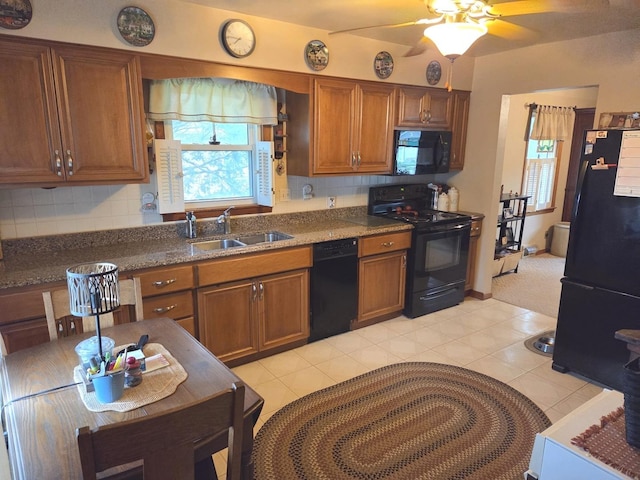 405 W Randolph St, Heyworth, IL 61745 - kitchen with black appliances, a sink, ceiling fan, brown cabinetry, and decorative backsplash
