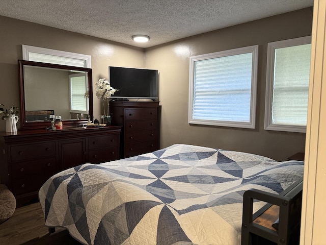 1401 Clement St, Joliet, IL 60435 - bedroom with a textured ceiling and wood finished floors