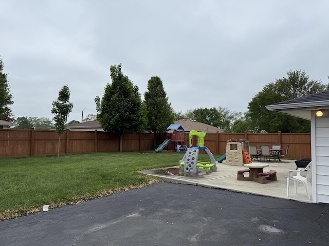 1401 Clement St, Joliet, IL 60435 - view of yard featuring a playground, a patio area, and outdoor dining area