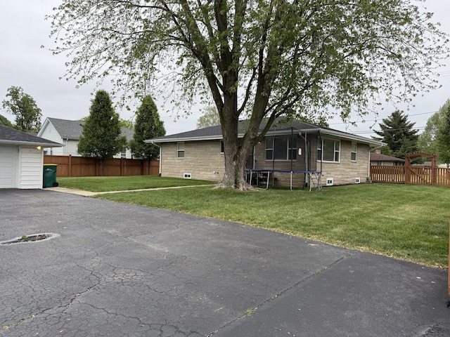1401 Clement St, Joliet, IL 60435 - back of property featuring a trampoline