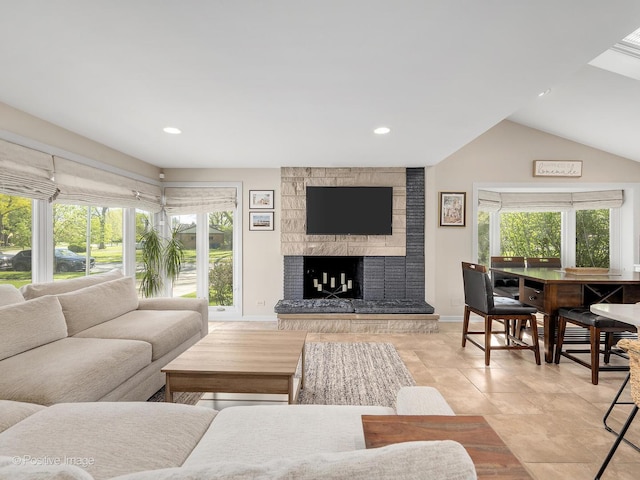 258 S Boyd Ave, Elmhurst, IL 60126 - living area with baseboards, a stone fireplace, recessed lighting, and lofted ceiling