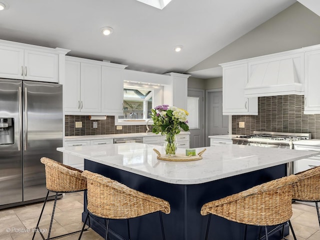 258 S Boyd Ave, Elmhurst, IL 60126 - kitchen featuring appliances with stainless steel finishes, lofted ceiling, backsplash, white cabinetry, and recessed lighting