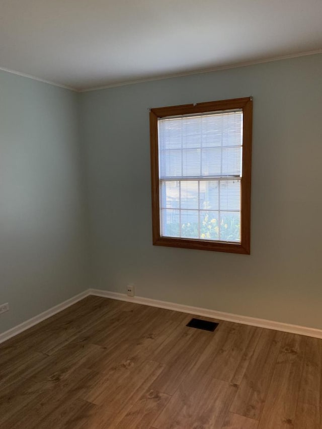 2307 Jay Ln, Rolling Meadows, IL 60008 - empty room with ornamental molding, wood finished floors, and baseboards