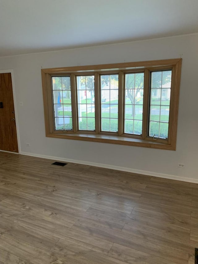 2307 Jay Ln, Rolling Meadows, IL 60008 - unfurnished room with baseboards and wood finished floors