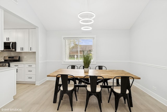 1220 E Rockwell St, Arlington Heights, IL 60005 - dining space with light wood-style floors and baseboards