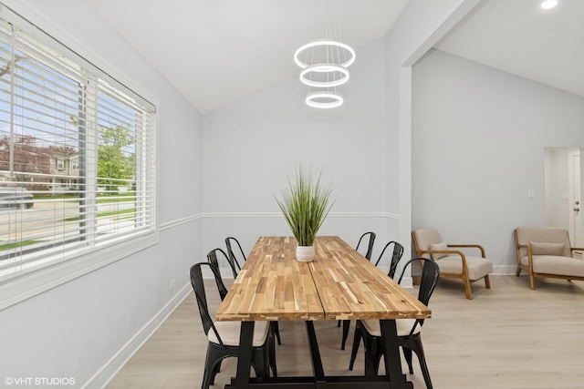 1220 E Rockwell St, Arlington Heights, IL 60005 - dining room with lofted ceiling, light wood-style floors, baseboards, and a chandelier
