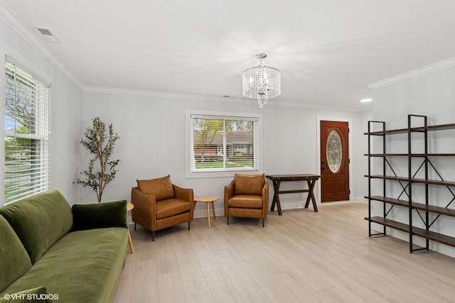 1220 E Rockwell St, Arlington Heights, IL 60005 - living area featuring a chandelier, healthy amount of natural light, crown molding, light wood-style flooring, and baseboards