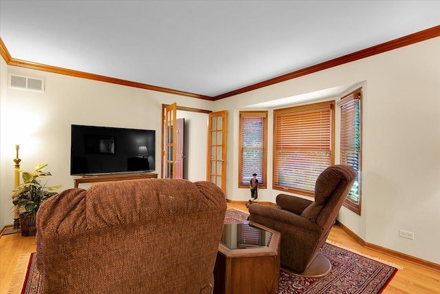 2551 Doncaster Dr, Aurora, IL 60504 - living room featuring light wood-style flooring, baseboards, and ornamental molding