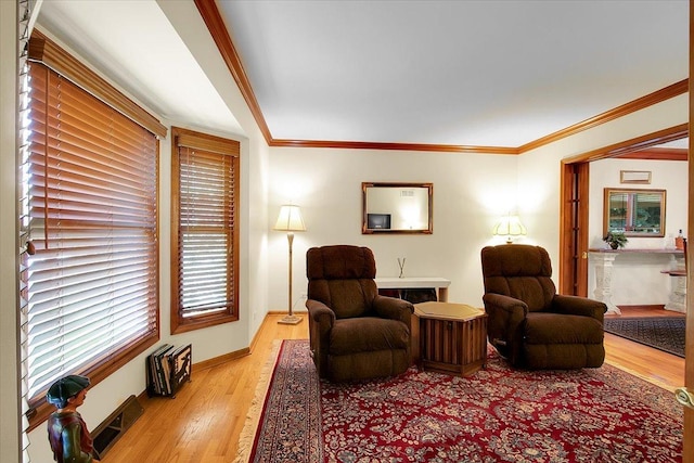 2551 Doncaster Dr, Aurora, IL 60504 - sitting room featuring light wood finished floors, ornamental molding, and baseboards