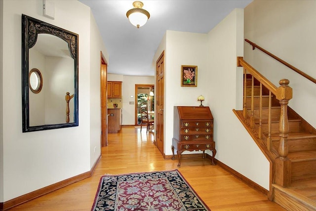 2551 Doncaster Dr, Aurora, IL 60504 - hall with light wood-style flooring, stairway, and baseboards