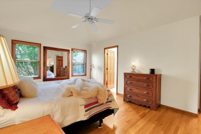 2551 Doncaster Dr, Aurora, IL 60504 - bedroom featuring light wood finished floors, baseboards, vaulted ceiling, and ceiling fan
